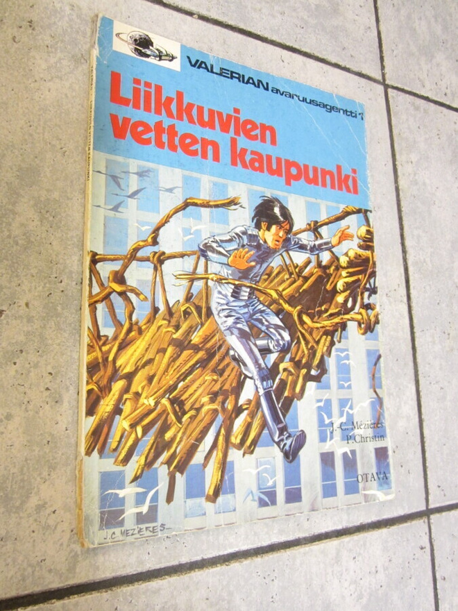 SARJAKUVA ALBUMI VALERIAN LIIKKUVIEN VETTEN KAUPUNKI