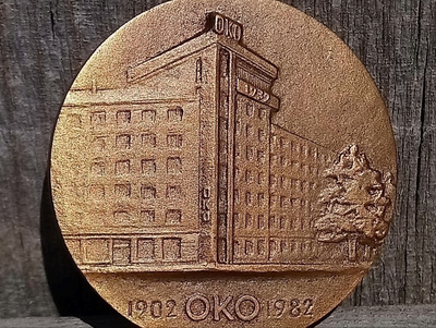 OKO - mitali rasiassa. Valmistajan leimalla. Halkaisija - 40