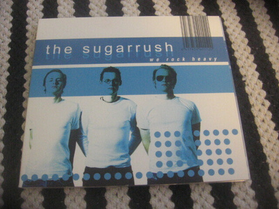 The Sugarrush - We Rock Heavy (cds)