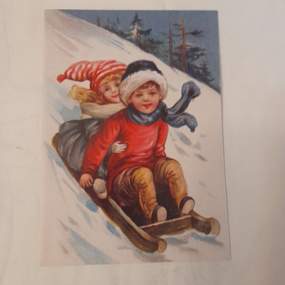 Lapset pulkassa taitekortti ja kuori