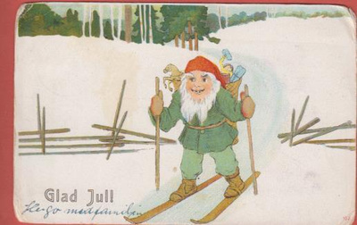 Tonttu hiihtää lahjakontti selässä