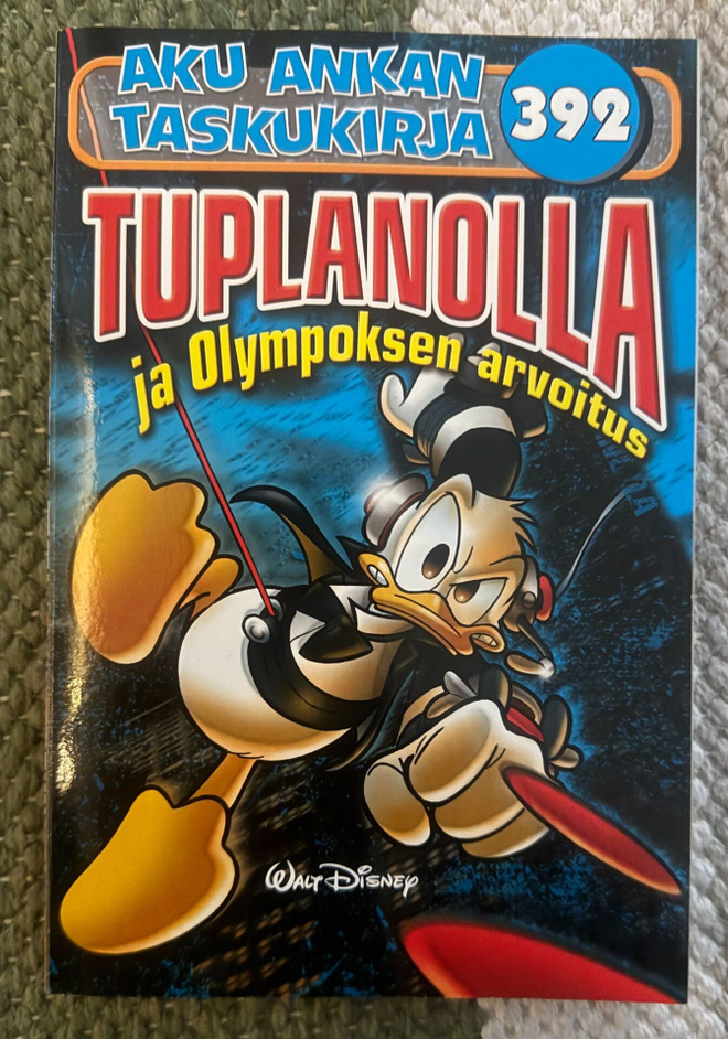 AKU ANKAN TASKUKIRJA 392 - TUPLANOLLA JA OLYMPOKSEN ARVOITUS