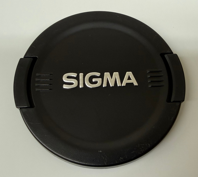 Käytetty Sigma 62mm linssisuojus, hopea logo