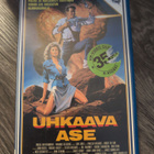 Uhkaava Ase vuokra VHS - pikkukuva 1
