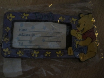 Nimilappu matkalaukkuun Nalle Puh lila