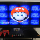 Nintendo 64 konsoli originaalit piuhat, ohjain ja Mario 64 - pikkukuva 2