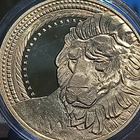 Kullanvärinen kolikko Leijona. Halkaisija - 38 mm. - pikkukuva 4