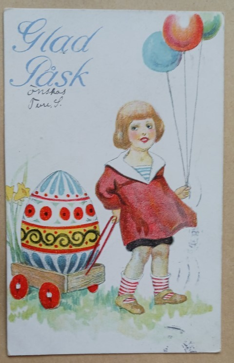 Pikkutyttö vetää jättimunaa kärreissä, ilmapalloja, p. 1940