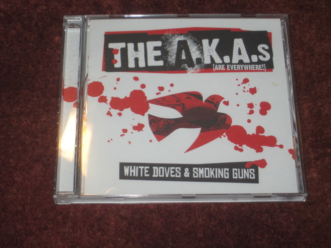 THE A.K.A.S - WHITE DOVES & SMOKING GUNS - CD