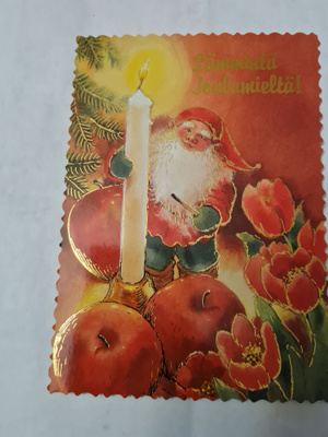 Joulupukki, kynttilä ja tulppaanit