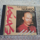 Tuomari Nurmio-Extra - pikkukuva 1