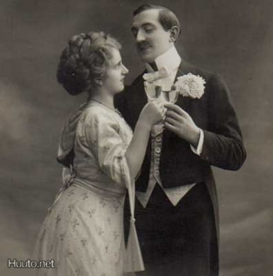 RAKKAUS / Kaunis tyttö ja mies kohottavat maljoja. 1900-l.