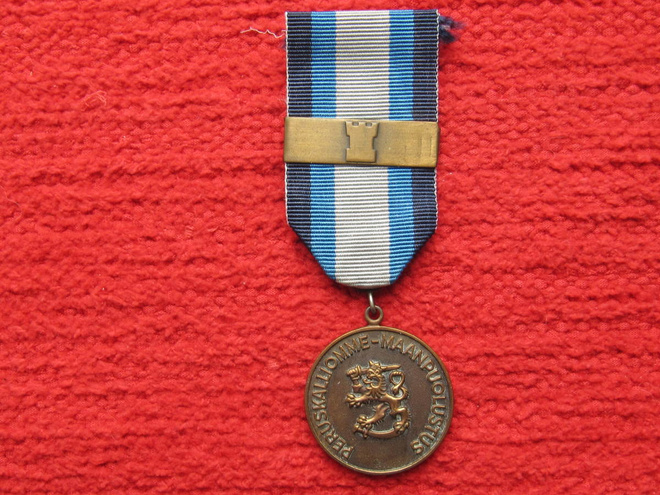Maanpuolustusmitali soljella