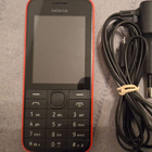 Nokia 208 puhelin + lataja - pikkukuva 1
