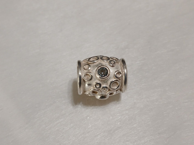 Kalevala koru, Hopea Lapsi-koru sinisellä topaasilla