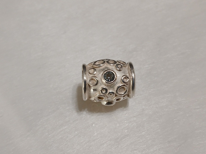 Kalevala koru, Hopea Lapsi-koru sinisellä topaasilla