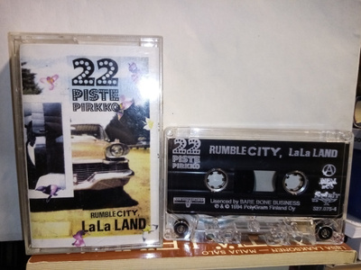 C-KASETTI : 22-PISTEPIRKKO :  RUMBLE CITY LALA LAND ( SIS PK