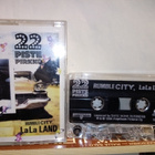 C-KASETTI : 22-PISTEPIRKKO :  RUMBLE CITY LALA LAND ( SIS PK - pikkukuva 1