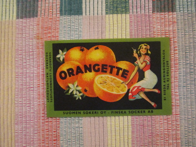 Orangette juomaetiketti .Suomen Sokeri Oy.