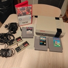 Nintendo 8-bit (NES) -konsolipaketti + 2 ohjainta + 3 peliä - pikkukuva 1