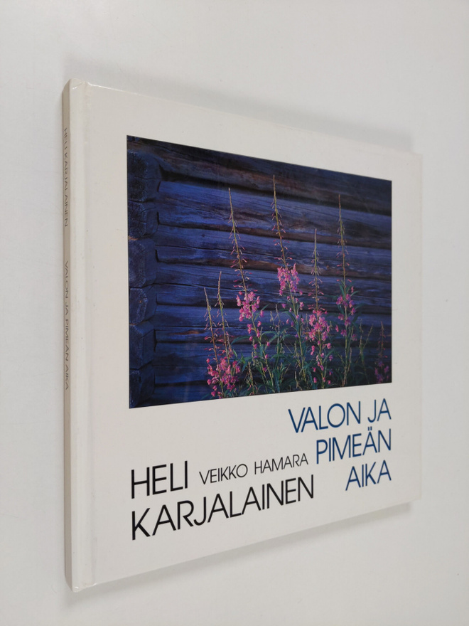 Heli Karjalainen : Valon ja pimeän aika