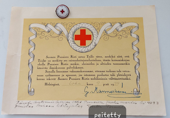 Suomen Punaisen Ristin Kutsumiskirja ja Rintamerkki