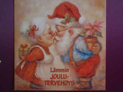 Joulupukki ja -mummo suukottavat
