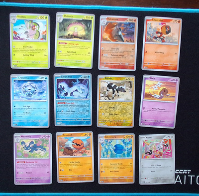 Pokemon kortit 12kpl (#107 Surging Sparks)