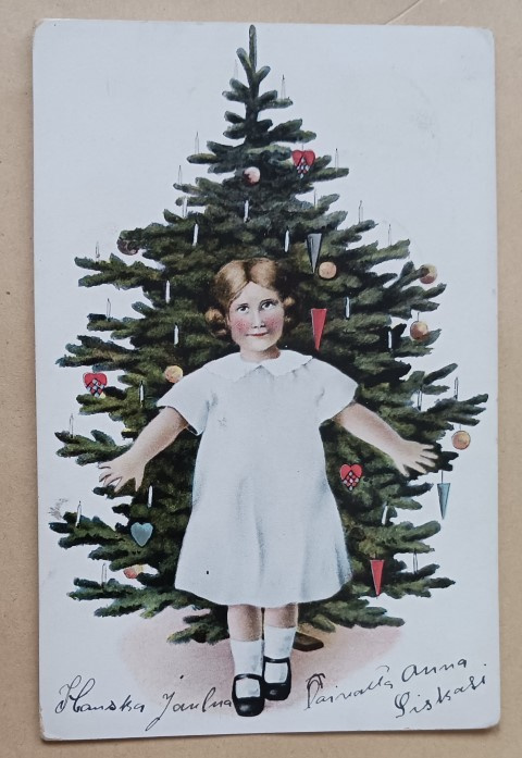 Pikkuleidi joulukuusen edessä, p. 1912