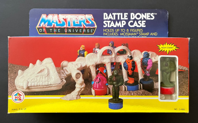 MOTU Battle Bones Stamp Case [MIB] + 7 leimaa [MOC]