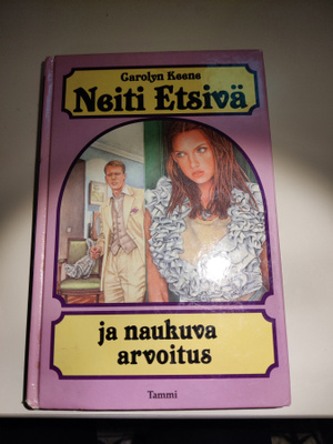 Neiti etsivä ja naukuva arvoitus Carolyn Keene