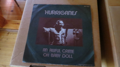 hurriganes single: an awful crime/oh baby doll 1976 lrs 2123
