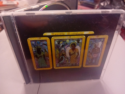CD The Neville Brothers : Yellow Moon ( SIS POSTIKULU  )
