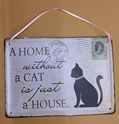 Kyltti A home without a cat is just a house