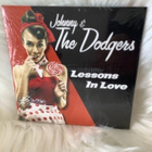 JOHNNY & THE DODGERS:LESSONS IN LOVE (UUSI,MUOVEISSA) - pikkukuva 1