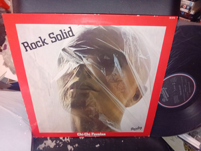 LP Chi Chi Favelas : Rock Solid ( SIS POSTIKULU )