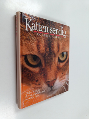 Roger A. Caras : Katten ser dig... : boken som får dig at...
