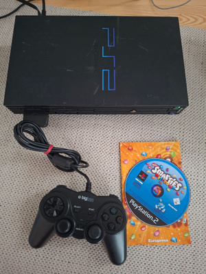 PS2 (50004) konsoli ja peli, ei virtajohtoa