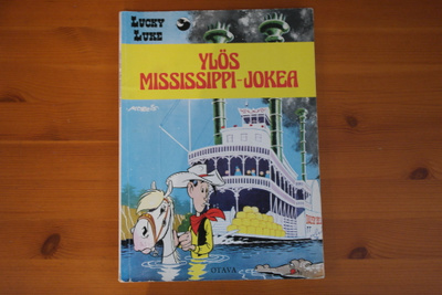 Lucky Luke:Ylös Missisippi-jokea.1.painos.Nid.
