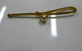 Kullattu solmioneula