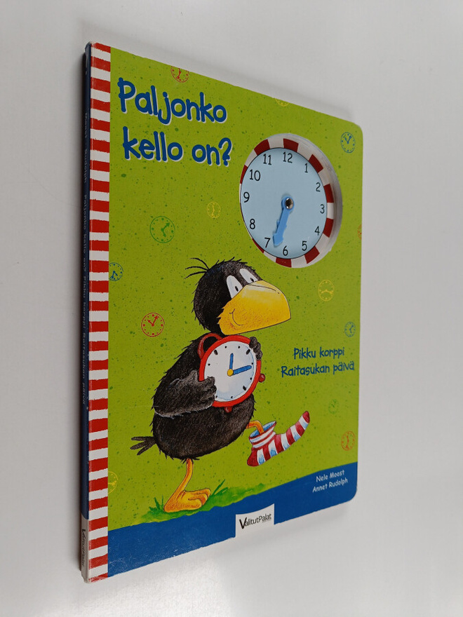 Nele Moost : Paljonko kello on? Pikku korppi Raitasukan p...