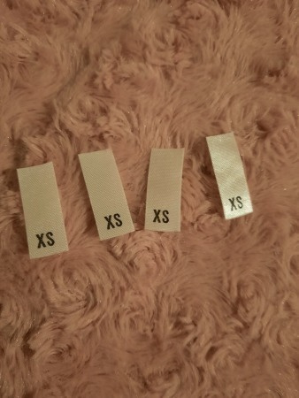 XS kokomerkki