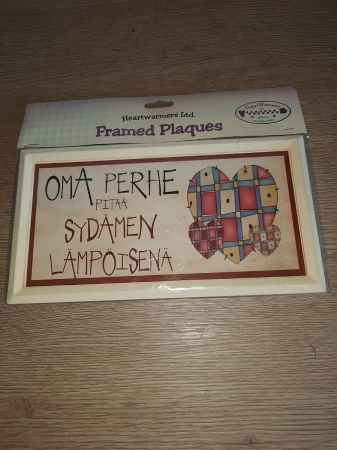 Kyltti : oma perhe pitää sydämen lämpöisenä