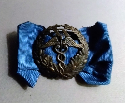 KAUPPAKAMARIN  ANSIOMERKKI 20 VUOTTA ( XX )
