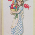 Leidi sylissään ruukku Pääsiäismunia, kukkia, p. 1934 - pikkukuva 1