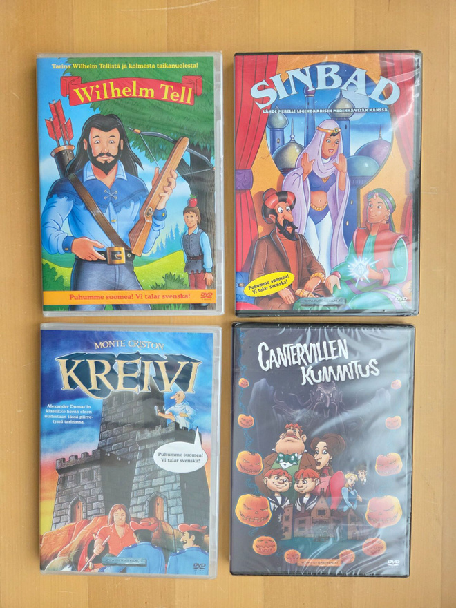 NELJÄ PIIRRETTYÄ LASTEN ELOKUVAA . DVD . AVAAMATTOMAT .
