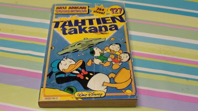 AKU ANKAN TASKUKIRJA 127 : TÄHTIEN TAKANA