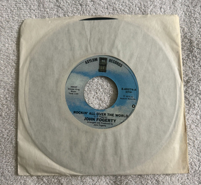 JOHN FOGERTY - ROCKIN' ALL OVER THE WORLD 7" SINGLE