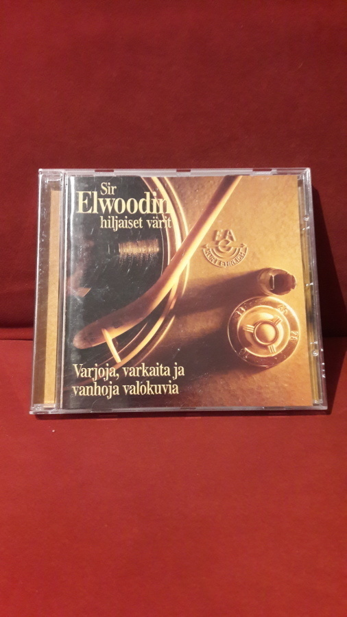 Sir Elwoodin Hiljaiset Värit – Varjoja, Varkaita Ja Vanhoja