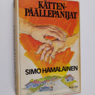 Simo Hämäläinen : Kättenpäällepanijat : ilosteleva kertom... - pikkukuva 1